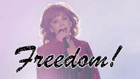 GIF of Reba McEntire singing with the caption "Freedom!"